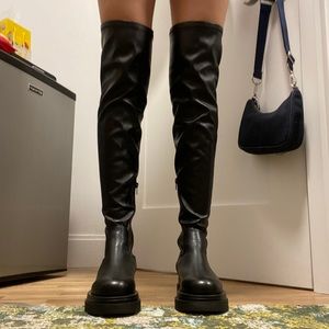 Over the knee black leather lug boots